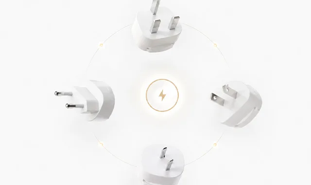 International plug adapters arranged around a power symbol